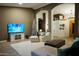 Spacious living room with plush furnishings, decorative archways, and bright natural light at 22364 N 59Th Ln, Glendale, AZ 85310