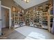 Well-organized pantry featuring extensive shelving, ample storage space, and bright lighting at 22364 N 59Th Ln, Glendale, AZ 85310