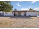 Spacious backyard featuring a covered patio and a low maintenance landscape, perfect for outdoor gatherings and relaxation at 224 N 58Th St, Mesa, AZ 85205