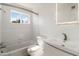 Modern bathroom featuring a sleek vanity with integrated sink, updated fixtures, and a shower-tub combination at 224 N 58Th St, Mesa, AZ 85205