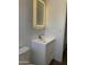 Modern bathroom vanity with a lighted mirror and sleek faucet at 224 N 58Th St, Mesa, AZ 85205