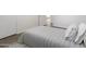 Cozy bedroom showcasing a comfortable bed and a view into an adjacent room at 224 N 58Th St, Mesa, AZ 85205