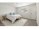 Inviting bedroom with a bed, rug, and natural light from the window at 224 N 58Th St, Mesa, AZ 85205