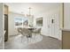 Stylish dining area with a round table, seating for four, and a bright window view at 224 N 58Th St, Mesa, AZ 85205