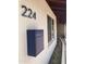 The front exterior features modern house numbers, and a stylish mailbox complementing the home's curb appeal at 224 N 58Th St, Mesa, AZ 85205