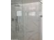 Close up of a luxurious shower with a rain shower head and marble-like walls at 224 N 58Th St, Mesa, AZ 85205