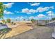 Spacious backyard featuring a block fence, mature trees, and lush landscaping creating a private retreat at 2261 E Decatur St, Mesa, AZ 85213