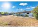 Expansive backyard featuring a well-maintained lawn, mature trees, and lush landscaping creating a peaceful outdoor oasis at 2261 E Decatur St, Mesa, AZ 85213