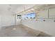 Unfinished basement area with concrete floors, white walls, and natural light at 2261 E Decatur St, Mesa, AZ 85213
