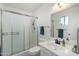 Clean bathroom featuring shower and vanity with updated fixtures at 2261 E Decatur St, Mesa, AZ 85213