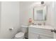 Cozy half bath features a modern vanity and neutral decor at 2261 E Decatur St, Mesa, AZ 85213