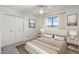 Cozy bedroom showcasing neutral tones, plush carpet, a window, and closet space for a comfortable and inviting atmosphere at 2261 E Decatur St, Mesa, AZ 85213