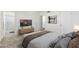 Bedroom featuring a TV, an adjacent bathroom with a glass shower door, and neutral decor with a cozy comfortable feel at 2261 E Decatur St, Mesa, AZ 85213