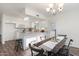 Bright kitchen with modern countertops, white cabinets, and stainless steel appliances open to dining area at 2261 E Decatur St, Mesa, AZ 85213