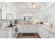 Bright kitchen with white cabinetry, modern countertops, and stainless steel appliances at 2261 E Decatur St, Mesa, AZ 85213