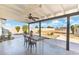 Charming covered patio featuring a ceiling fan and outdoor seating, perfect for relaxing and entertaining with a view at 2261 E Decatur St, Mesa, AZ 85213