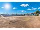 Large vacant lot with block fencing, perfect for building your dream home or investment property at 2261 E Decatur St, Mesa, AZ 85213