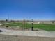 Tranquil community park features walking paths, benches, and well-maintained green spaces for residents at 24254 W Hidalgo Ave, Buckeye, AZ 85326