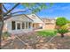 Spacious backyard featuring a grass area and mature trees at 2620 E Rustling Oaks Ln, Phoenix, AZ 85024