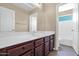 Bathroom with wood cabinets, double sinks, and tiled floors and shower at 2620 E Rustling Oaks Ln, Phoenix, AZ 85024