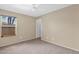 Bedroom with neutral walls, carpet, and a window that provides natural light at 2620 E Rustling Oaks Ln, Phoenix, AZ 85024