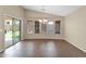 Bright dining room with tile flooring, chandelier, and sliding glass door leading to the patio at 2620 E Rustling Oaks Ln, Phoenix, AZ 85024