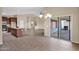 Open-concept living area with a view of the kitchen, dining area, and outdoor patio at 2620 E Rustling Oaks Ln, Phoenix, AZ 85024