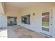 Covered patio features tile flooring, windows, and doors at 2620 E Rustling Oaks Ln, Phoenix, AZ 85024