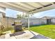 Enjoy outdoor grilling with a barbecue on the patio overlooking the green backyard and block wall at 3553 W El Camino Dr, Phoenix, AZ 85051