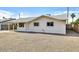 A charming home exterior with a gravel yard, covered carport, and well-maintained landscaping at 3553 W El Camino Dr, Phoenix, AZ 85051