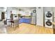 Updated kitchen featuring stainless steel appliances, a breakfast bar, and washer/dryer at 3553 W El Camino Dr, Phoenix, AZ 85051