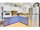 Well-equipped kitchen featuring stainless steel refrigerator, oven, and ample cabinet space at 3553 W El Camino Dr, Phoenix, AZ 85051