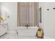 Luxurious bathroom featuring a freestanding tub and elegant fixtures at 4024 E Minton Cir, Mesa, AZ 85215