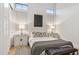 Modern bedroom featuring high ceilings, neutral tones, stylish lamps, and tasteful decor at 4024 E Minton Cir, Mesa, AZ 85215