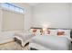 Bright bedroom featuring two beds, soft carpets, and a window with natural light at 4024 E Minton Cir, Mesa, AZ 85215