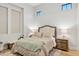 Neutral bedroom with a cozy bed, matching nightstands, and two bright windows at 4024 E Minton Cir, Mesa, AZ 85215