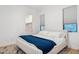 Minimalist bedroom featuring neutral colors, a modern bed frame, and a walk-in closet at 4024 E Minton Cir, Mesa, AZ 85215