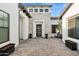 Welcoming home entrance with stone accents, a modern door and decorative landscaping at 4024 E Minton Cir, Mesa, AZ 85215