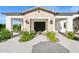 Elegant home entrance with inviting courtyard, decorative plants, and custom stonework at 4024 E Minton Cir, Mesa, AZ 85215