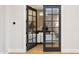 Home office featuring a glass french door entrance, modern chandelier, and contemporary furnishings at 4024 E Minton Cir, Mesa, AZ 85215
