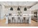 Bright, modern kitchen with a large island, stainless steel appliances, and sleek white cabinetry at 4024 E Minton Cir, Mesa, AZ 85215