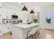 Beautiful kitchen with island, modern white cabinets and eat in bar at 4024 E Minton Cir, Mesa, AZ 85215