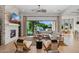 Inviting living room featuring a stone fireplace, plush seating, and seamless indoor-outdoor living at 4024 E Minton Cir, Mesa, AZ 85215