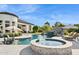 Backyard swimming pool with spa, rock waterfall, slide and relaxing lounge chairs at 4024 E Minton Cir, Mesa, AZ 85215