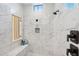 Modern walk-in shower with sleek tile and a built-in bench at 4024 E Minton Cir, Mesa, AZ 85215