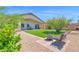 Beautiful backyard featuring a green lawn, patio area, and mature trees for a serene outdoor experience at 4611 E Night Glow Dr, Cave Creek, AZ 85331