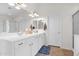 Bright bathroom with double vanity, white cabinets, and tiled floors near shower and toilet at 4611 E Night Glow Dr, Cave Creek, AZ 85331