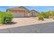 The property features low-maintenance desert landscaping and a spacious driveway leading to the garage at 4611 E Night Glow Dr, Cave Creek, AZ 85331