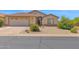 Charming single-story home with desert landscaping, two car garage, and a gated front entry at 4611 E Night Glow Dr, Cave Creek, AZ 85331