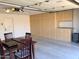 Spacious garage with ample storage cabinets and a functional table great for projects at 4611 E Night Glow Dr, Cave Creek, AZ 85331